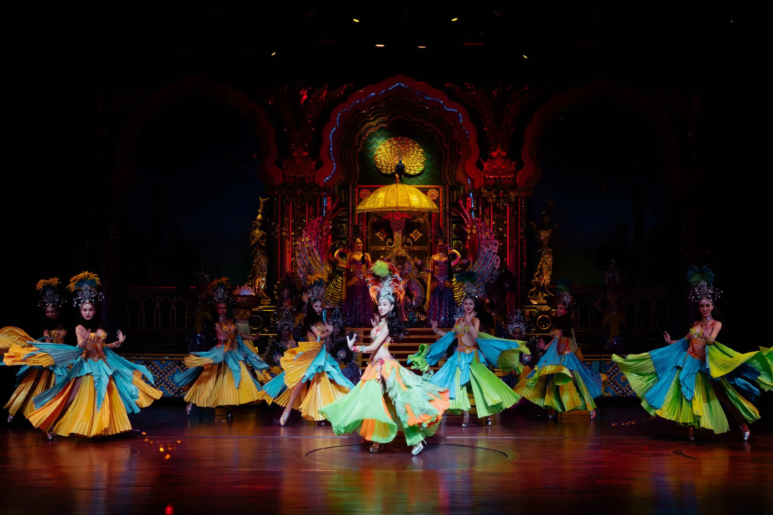 Colourful dance act under LED lighting at the Alcazar Cabaret Show theatre