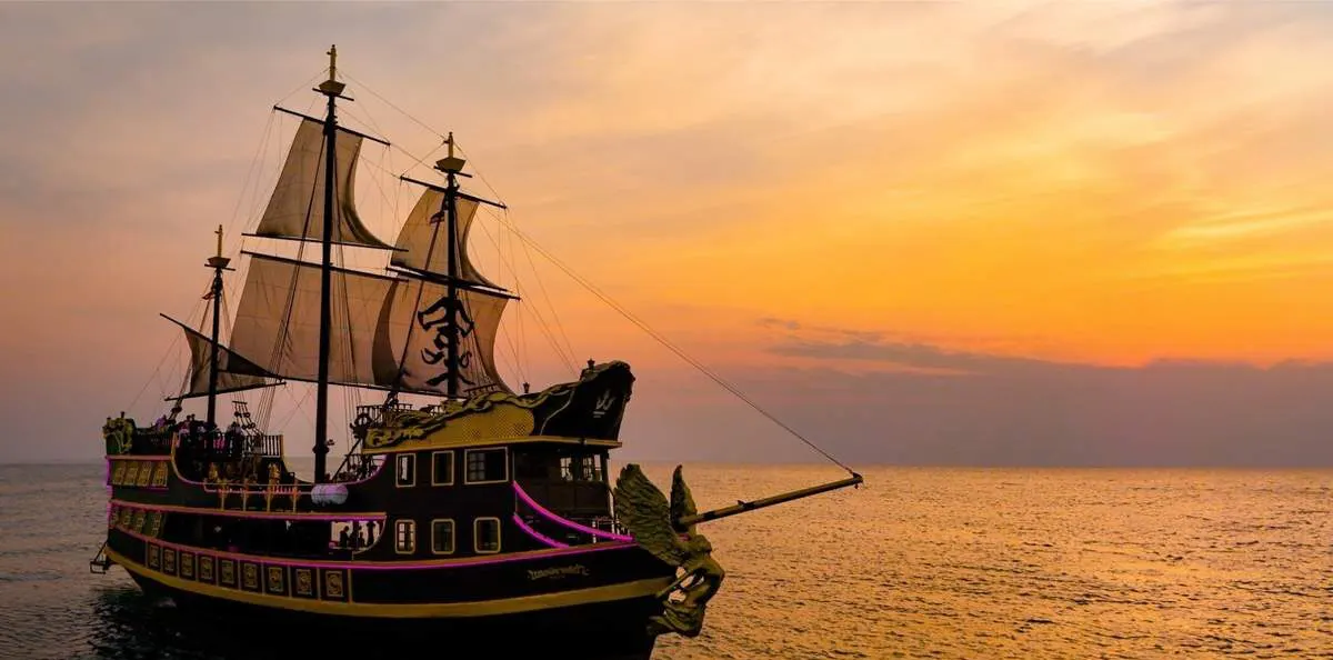 Black Pearl pirate ship at sunset with LED-lit hull, Pattaya