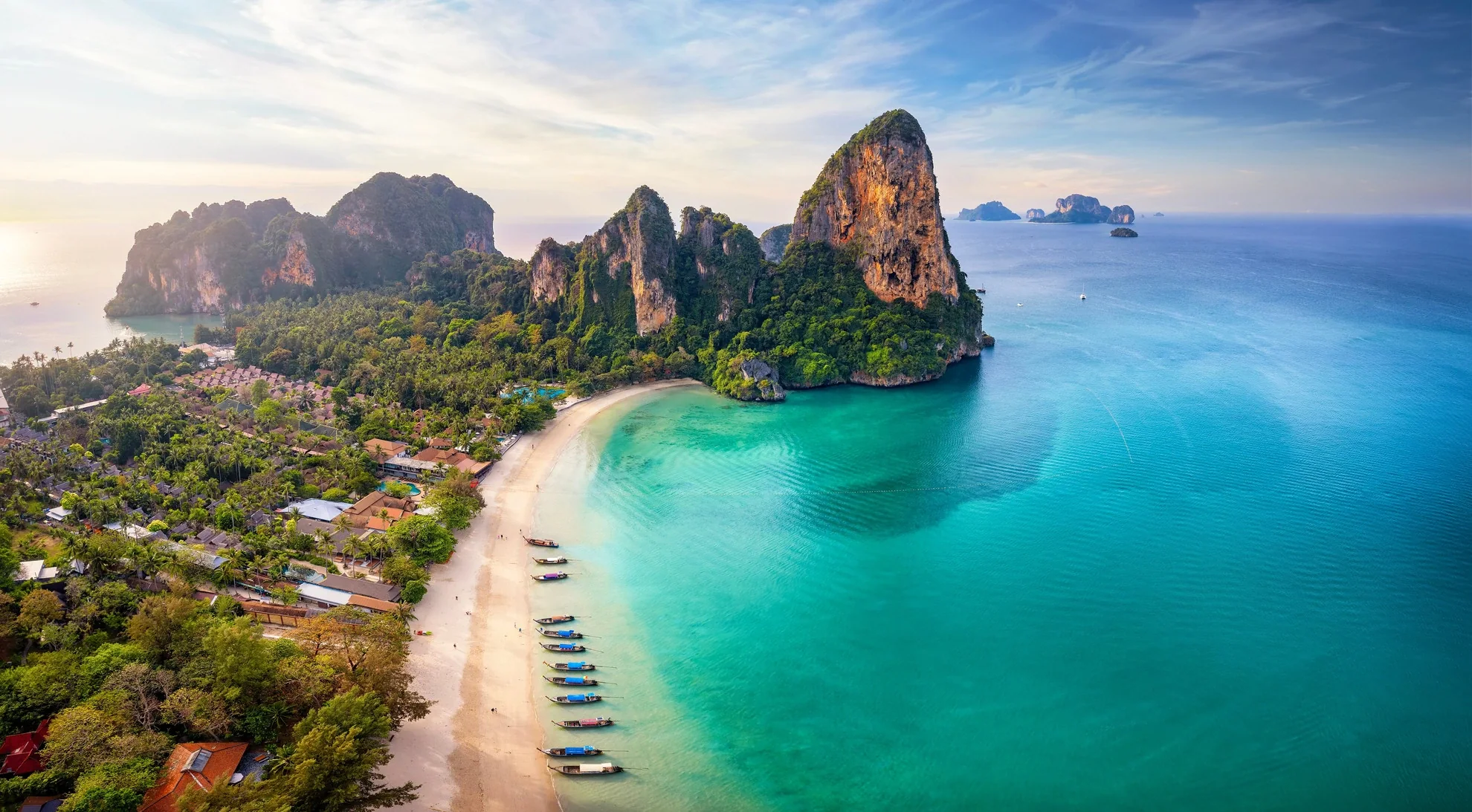 White-sand beach and limestone cliffs on the Krabi island-hopping route